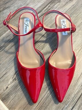 Red patent pointed-toe slingback kitten heels